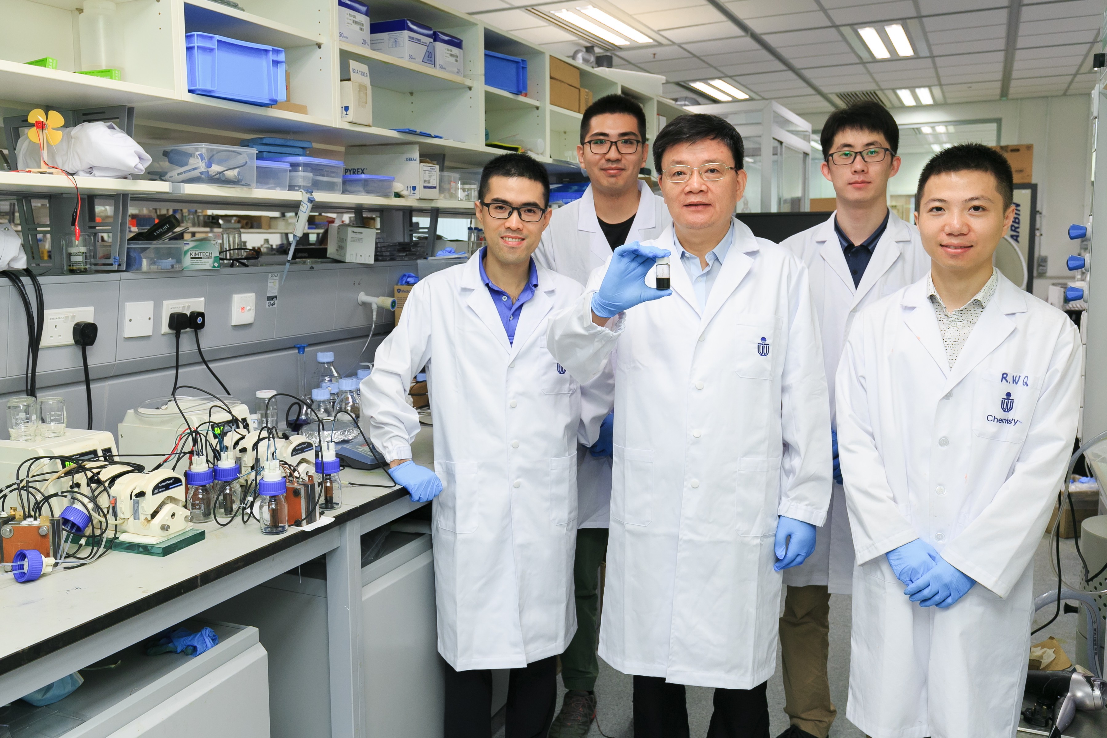 Prof. Zhao Tianshou (middle) and Prof. Chen Qing (first from left) and their research teams.