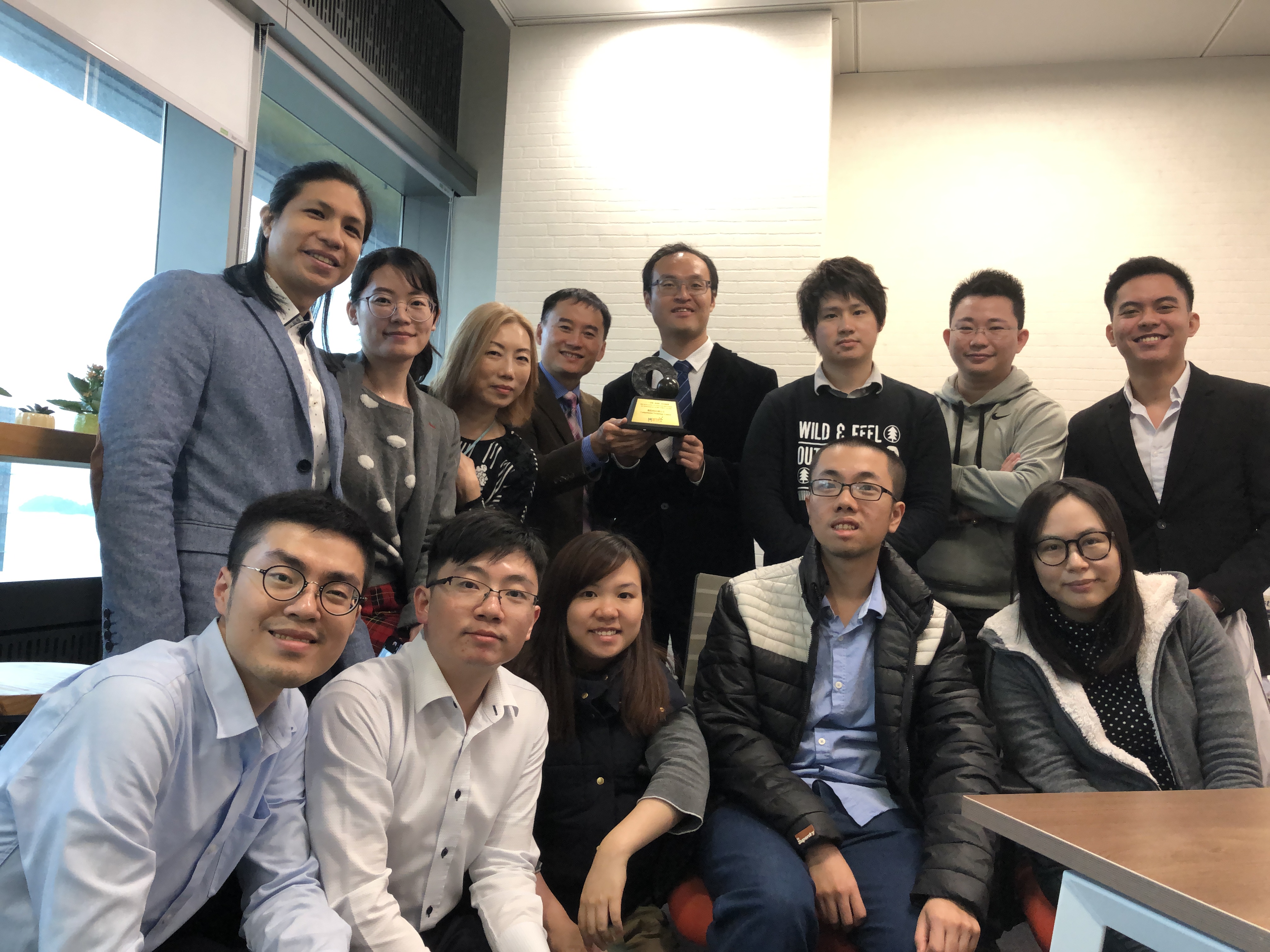 Prof. Gary Chan (fourth left, back) with Mr. Arthur Chan (fourth right, back) and the Compathnion team.