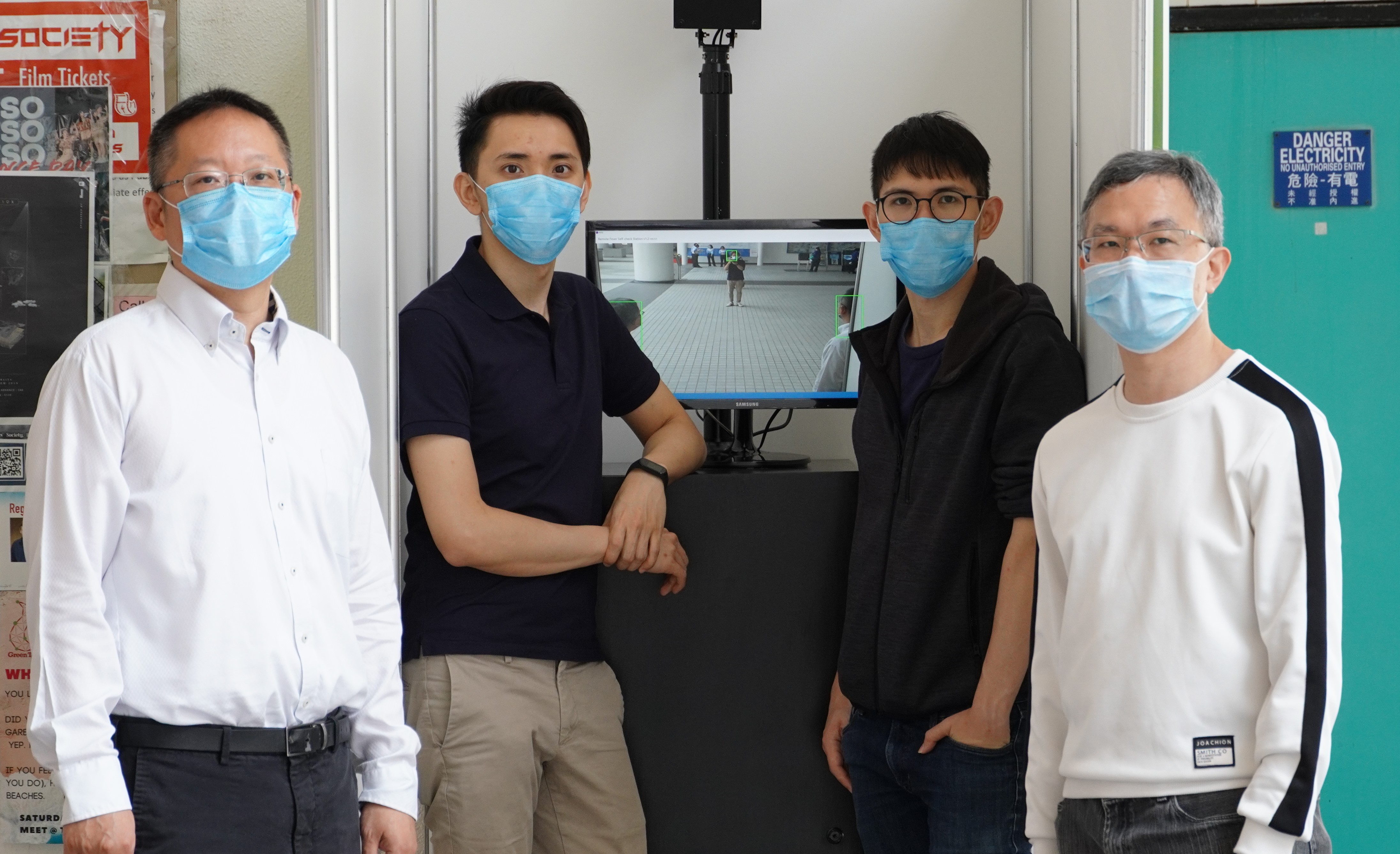 Prof. Richard SO (first left) and his research team members develop a new AI-based Smart Fever Screening System.
