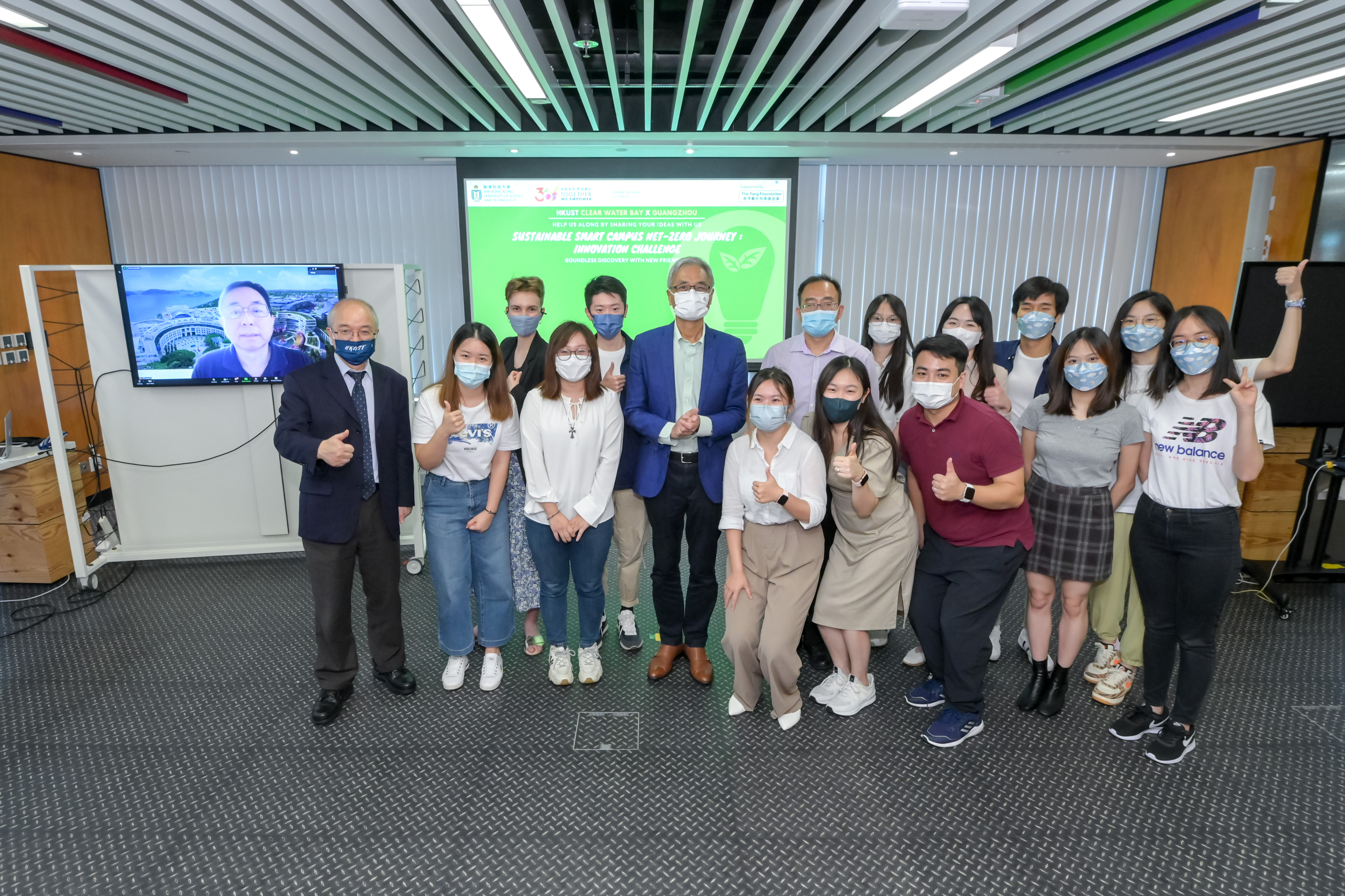 Prof. Wei SHYY, HKUST President (second row, fourth left); Prof. Lionel NI, HKUST(GZ) President (on the left screen); Prof. WANG Yang, HKUST Vice-President for Institutional Advancement (first left) and Prof. QU Huamin, Director of Interdisciplinary Programs Office (second row, fifth left) present awards to the winning teams of the Innovation Challenge.