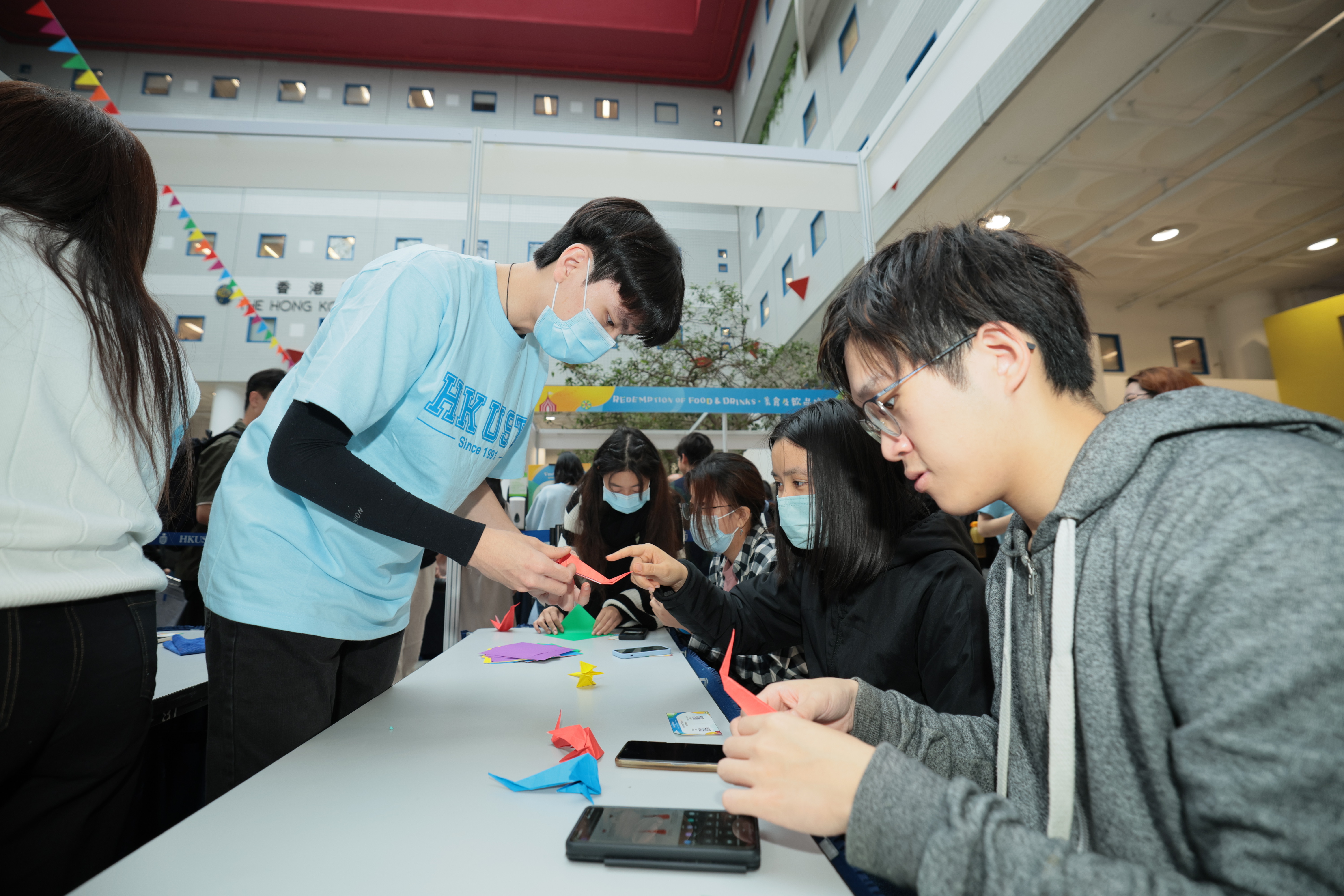 Participants take part in a variety of game booths and make their own red bird origamis 