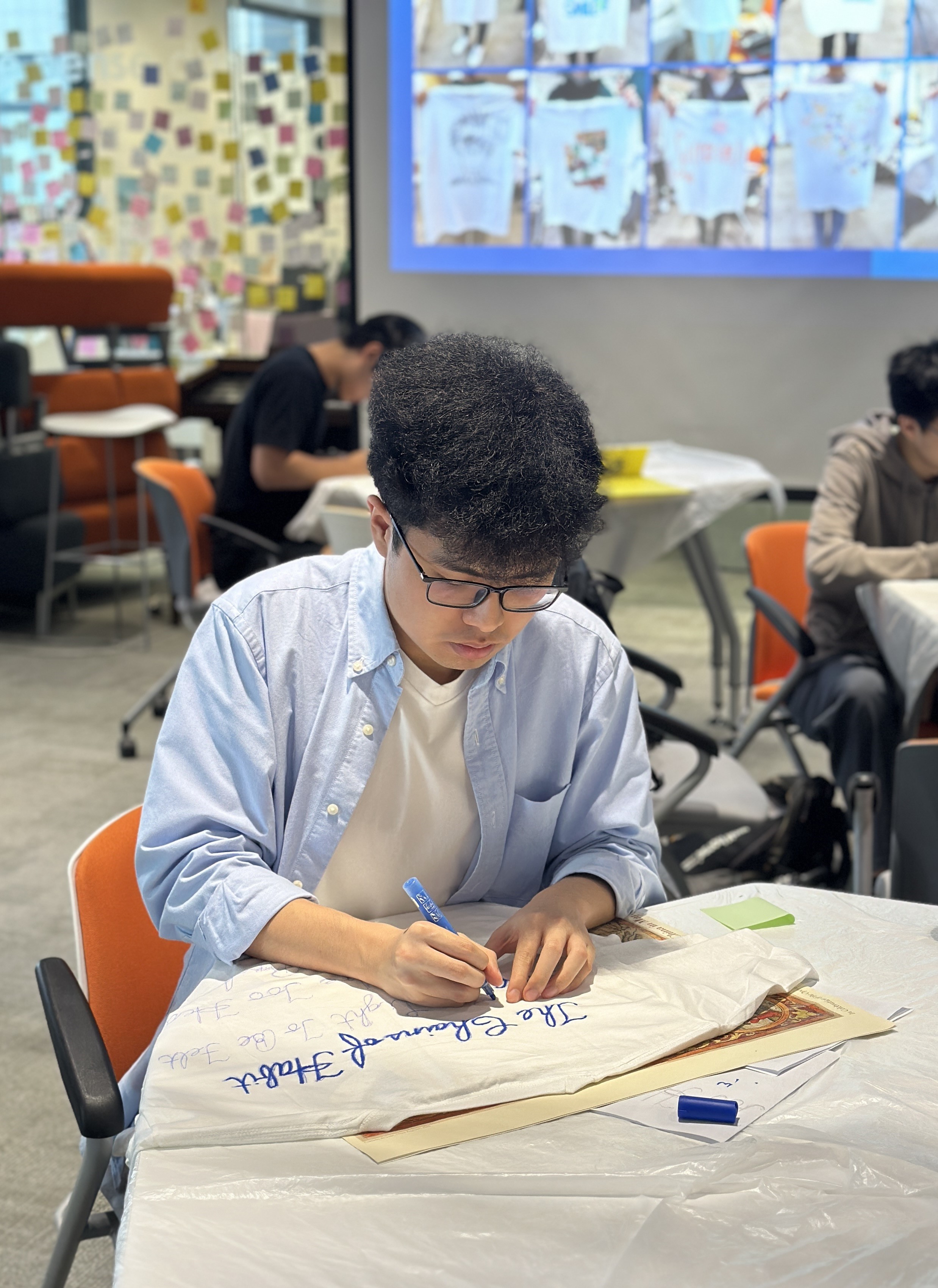 Students designing T-shirt in the lesson