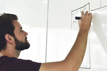 Man writing on a whiteboard