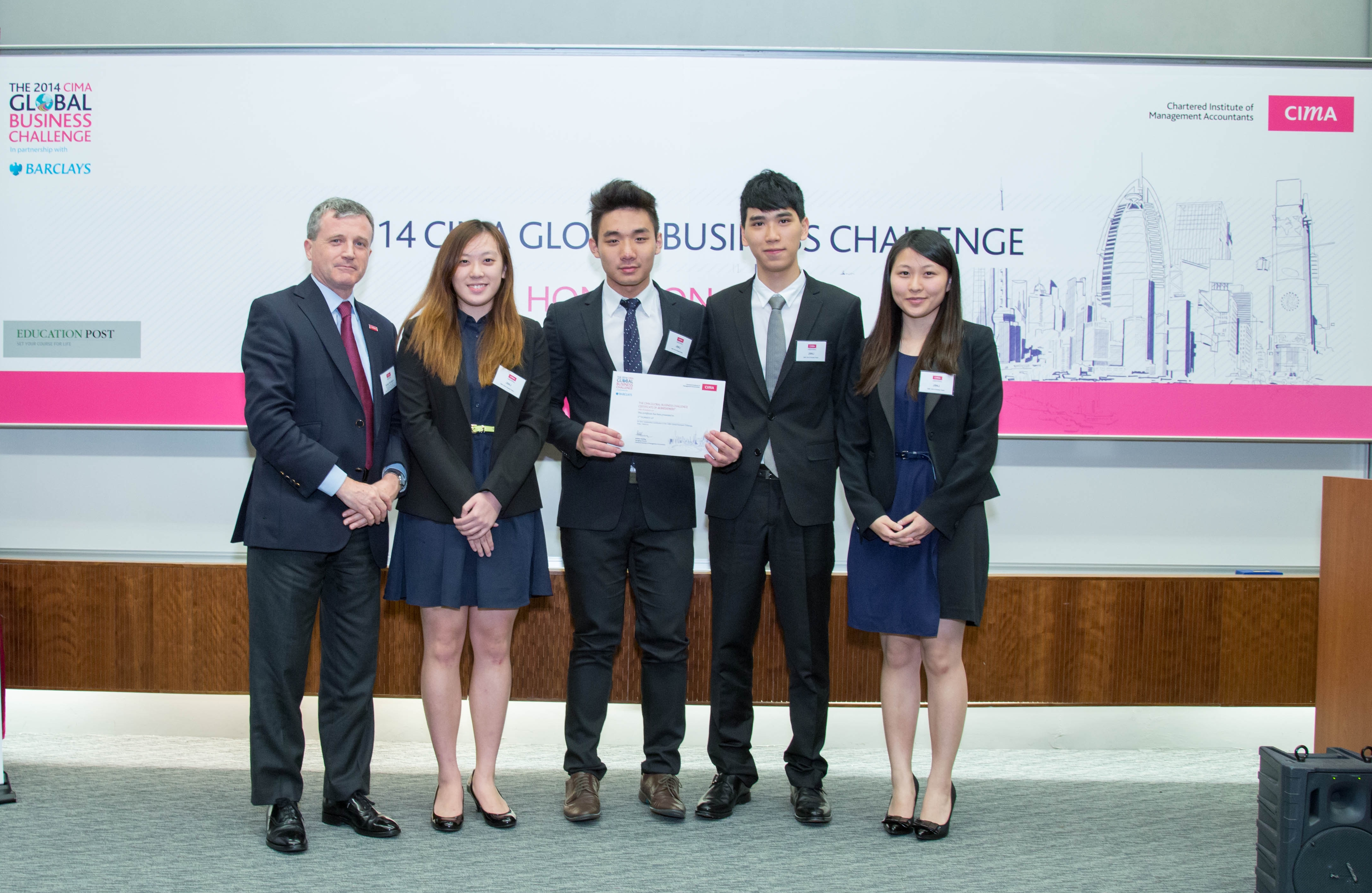  The second runner-up team (from second left): Kandy Ho, Jonathan Hung, Jordy Hui, and Sandy Cheng. Kandy is also the winner of the “Best Future Business Leader”.