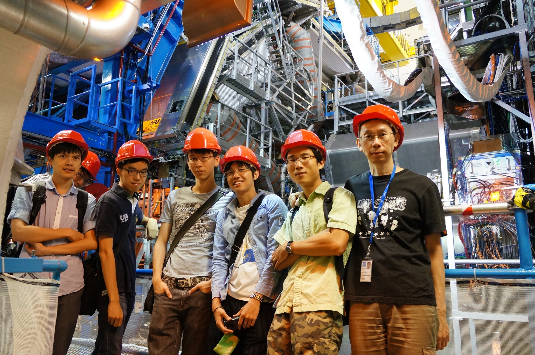  Part of the Hong Kong team in front of the ATLAS detector.