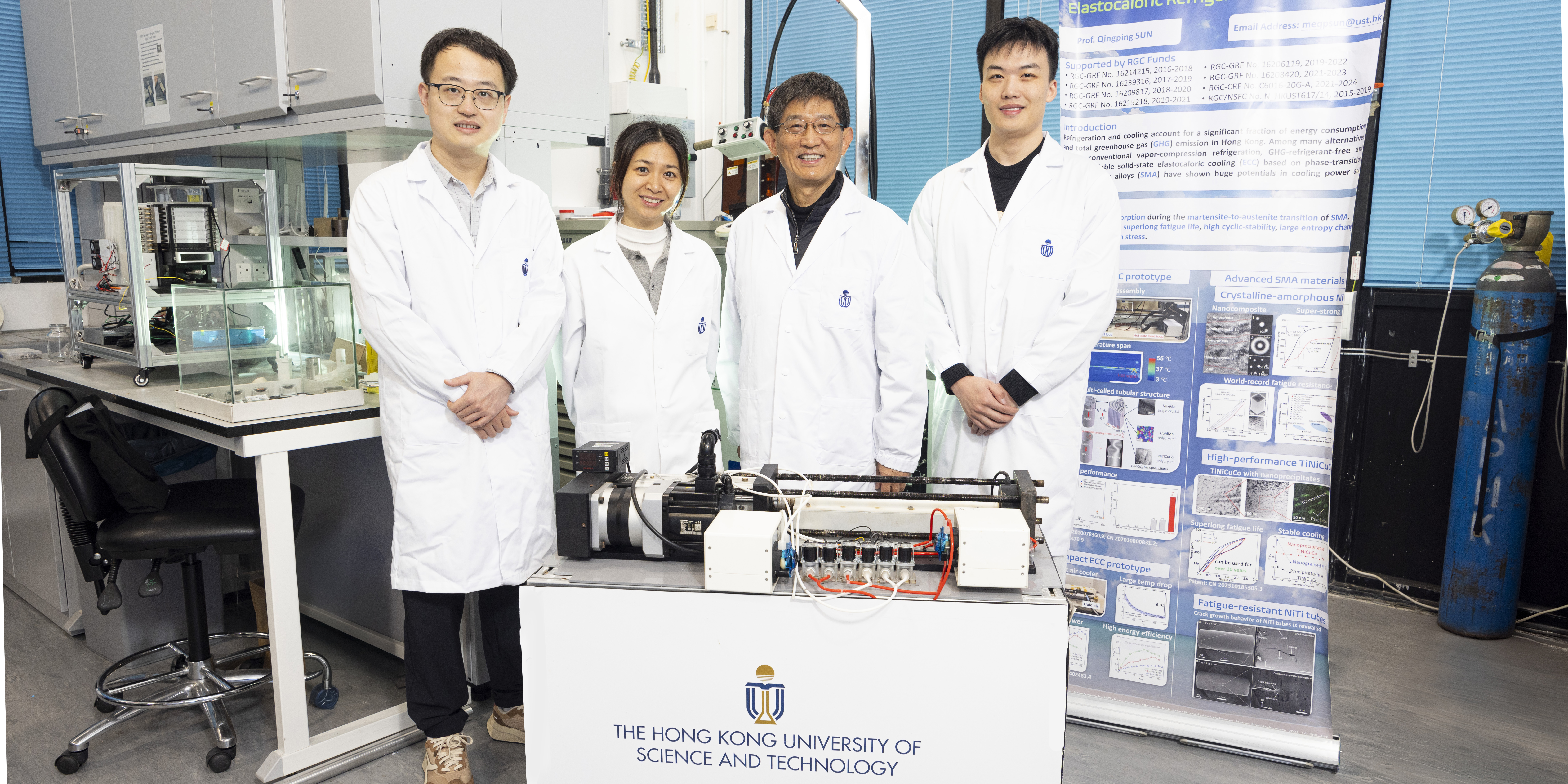 Prof. SUN Qingping (second right) and Prof. YAO Shuhuai (second left), both Professors of the Department of Mechanical and Aerospace Engineering (MAE), MAE Postdoctoral Research Associate Dr. ZHOU Guoan (first left), and MAE PhD student LI Zexi (first right) with the world’s first kilowatt-scale elastocaloric green cooling device they develop.