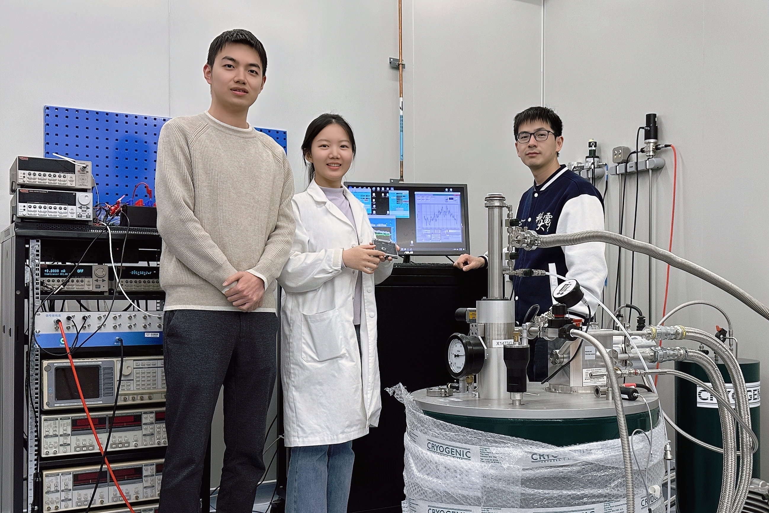A photo of authors with a cryogenic system: Prof. SHAO Qiming (right), PhD students QIAN Kun (center) and LIU Ruizi (left) from the Department of Electronic and Computer Engineering.