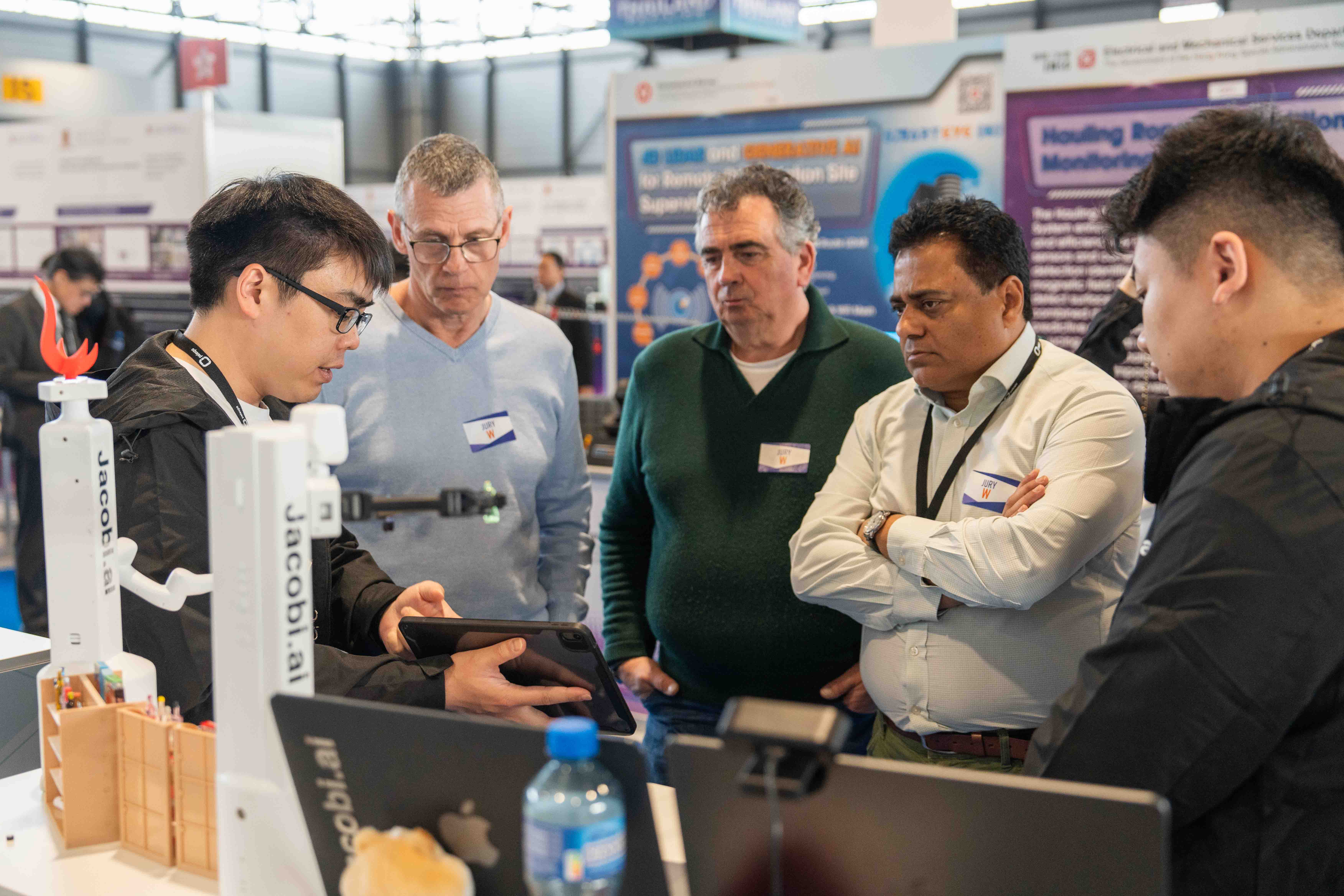 Nearly 40% of HKUST’s submissions this year have deployed AI into their inventions.  One of the teams introduces their AI applications in a robotic project to the judges.