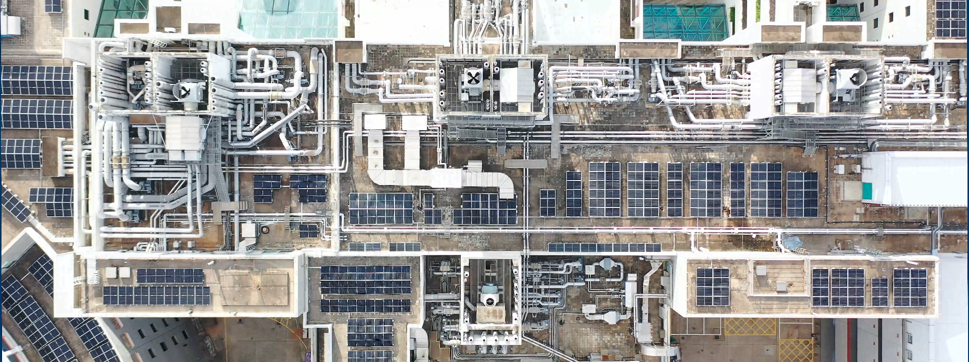 The $30 million investment is financed by Feed-in-Tariff payments from the university’s 2.5 megawatt (MW) solar photovoltaic system, the largest institutional system of its kind in Hong Kong. The photo shows the large-scale extent of solar panels installed on the rooftop of the Main Academic Buildings.