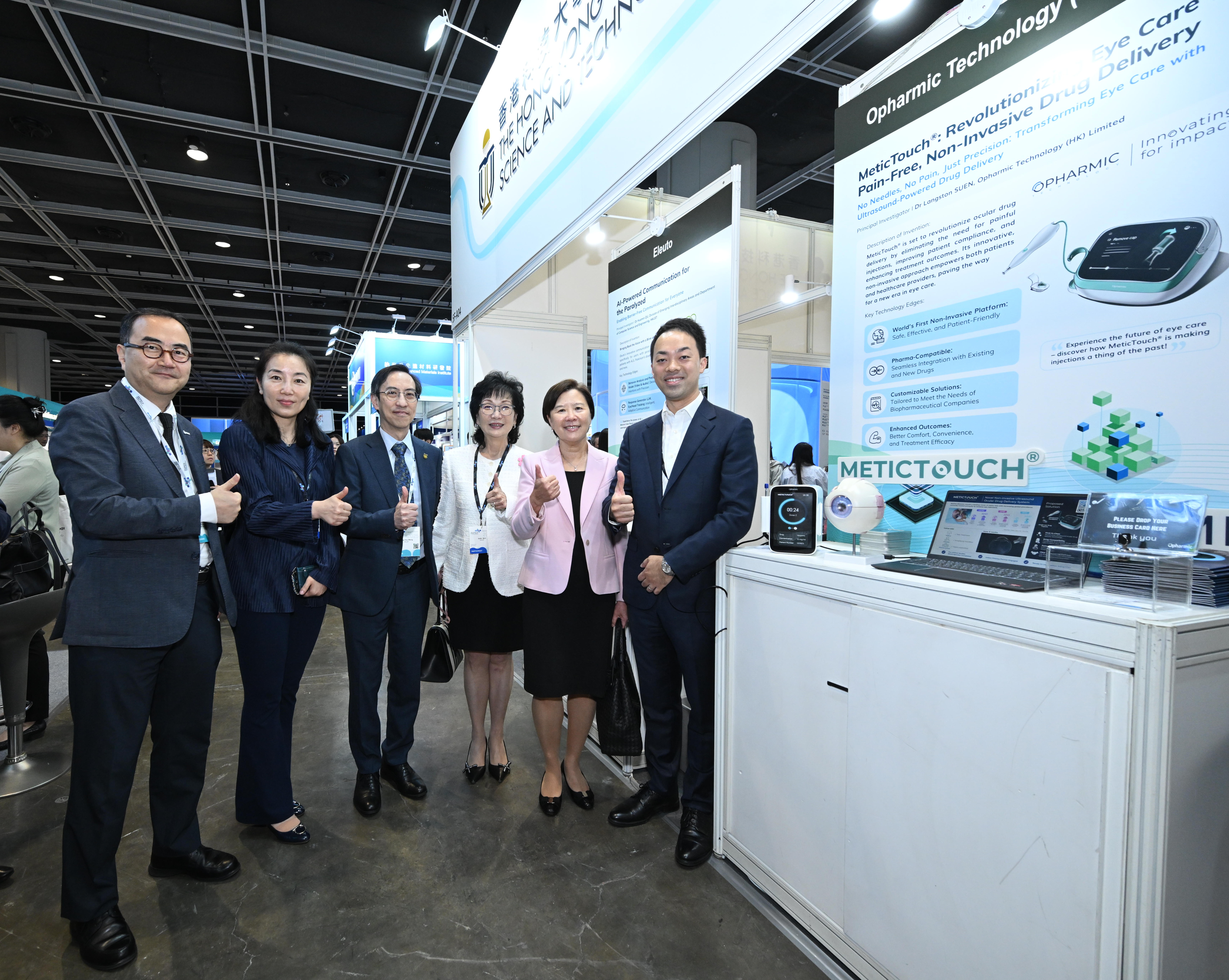 HKUST President Prof. Nancy IP (second right) and Council Vice Chairperson Ms. Edith SHIH (third right), along with other University management and guest, visit the showcase booths of HKUST startups, featuring a diverse array of innovative solutions spanning prevention, diagnosis, treatment, and prognosis.