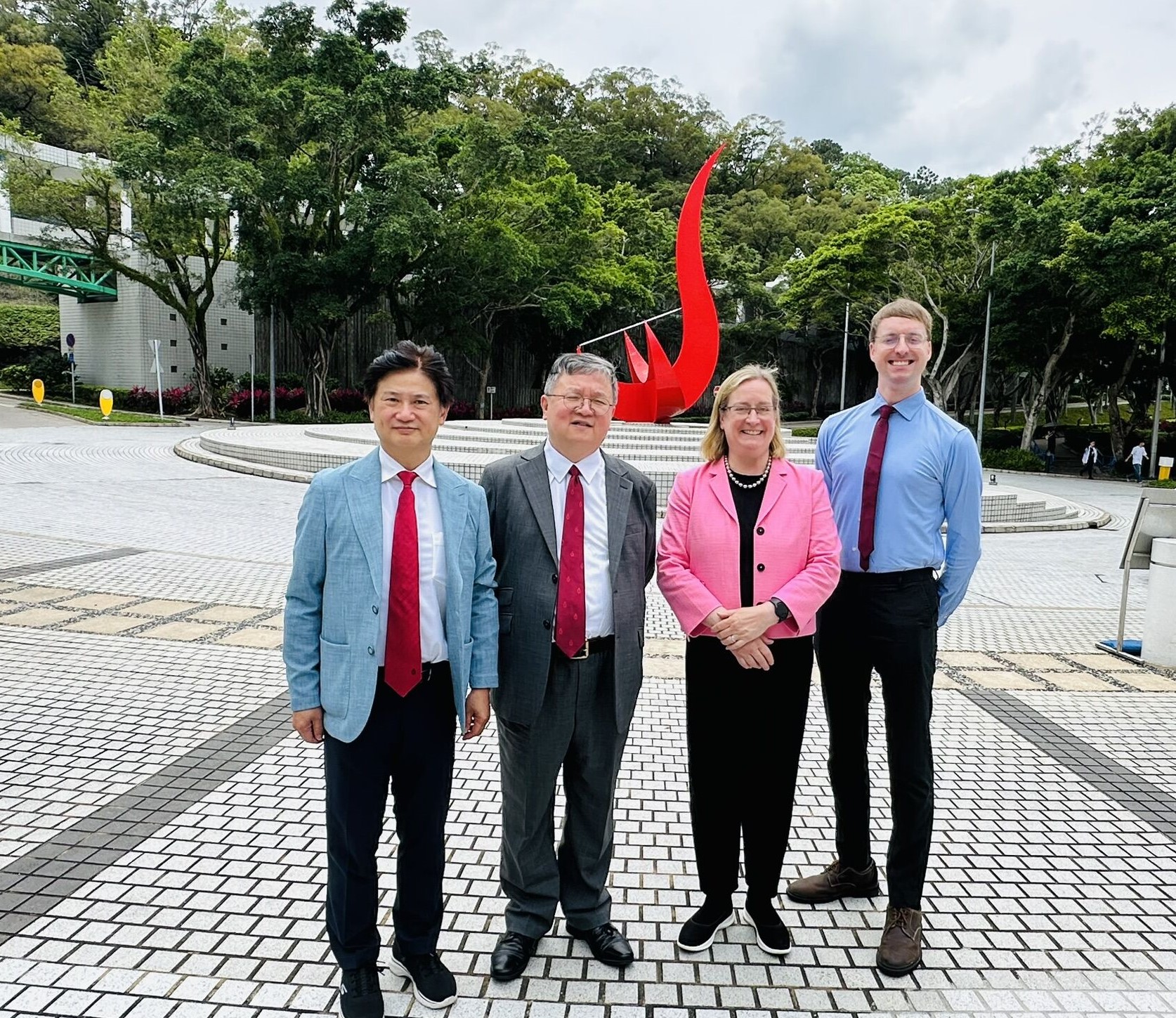 A group photo (from left) featuring HKUST (Guangzhou) Vice-President and Dean of HKUST Fok Ying Tung Graduate School Prof. Charles NG, HKUST Provost Prof. GUO Yike, University of Bristol Vice-Chancellor and President Prof. Evelyn WELCH and Director of Global Partnerships Michael BENSON, taken in front of the iconic "Red Bird" sculpture at the Piazza.