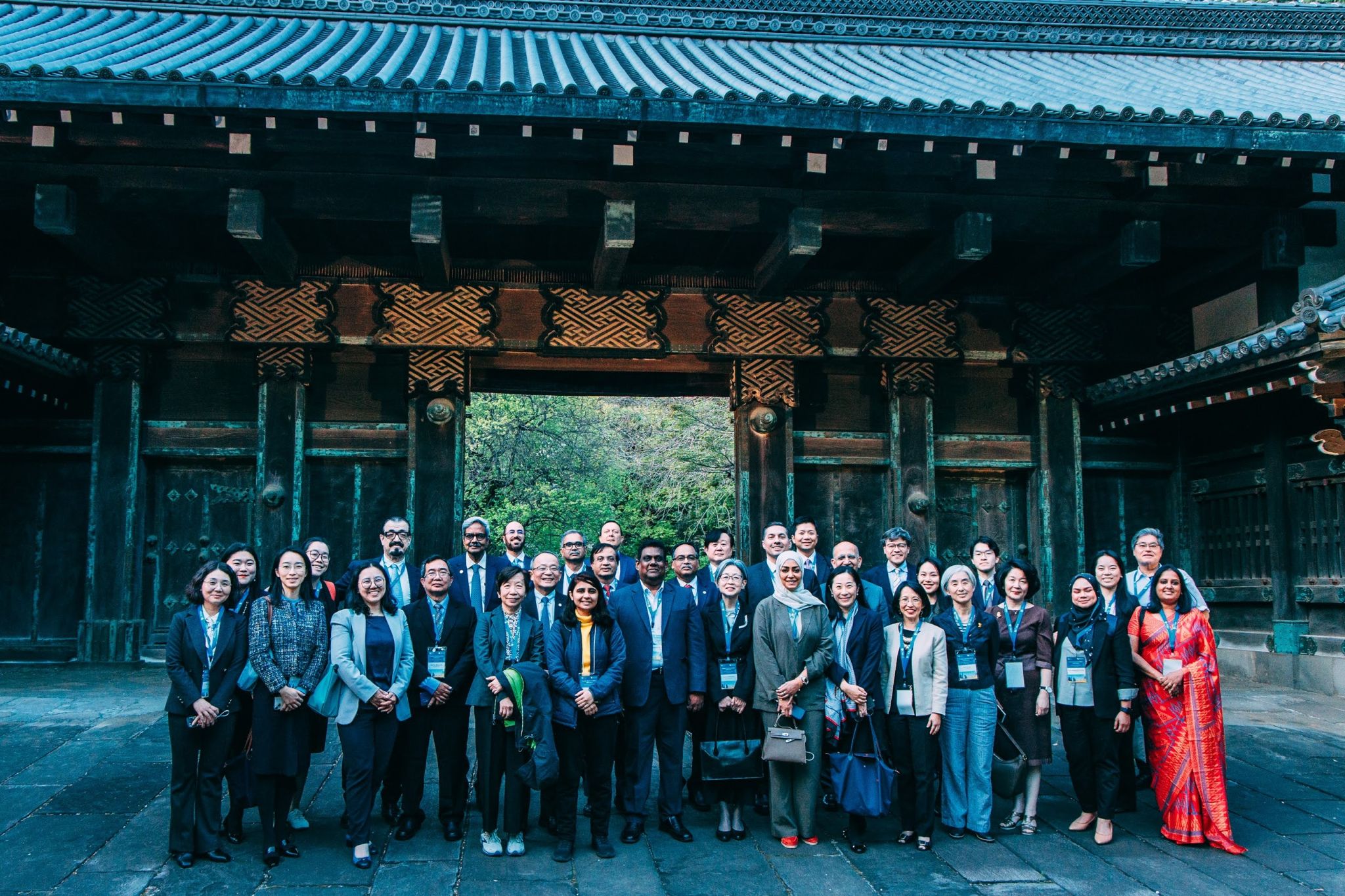 Group photo at the signature Akamon, a historical red gate on the campus of The University of Tokyo.