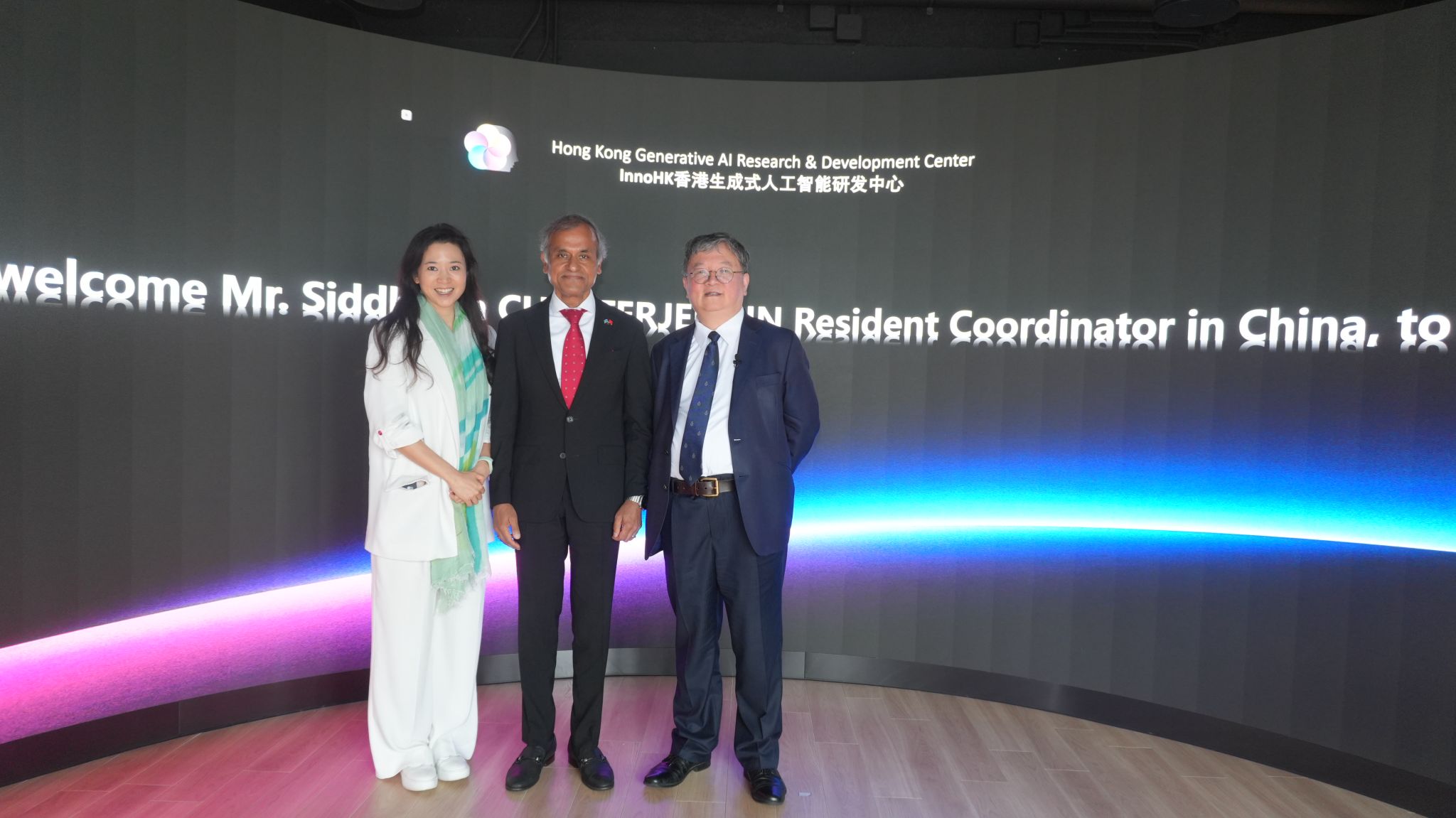 United Nations Resident Coordinator in China Siddharth CHATTERJEE (center) and Council Member Prof. Poman LO (left) visit the Hong Kong Generative AI Research and Development Center.