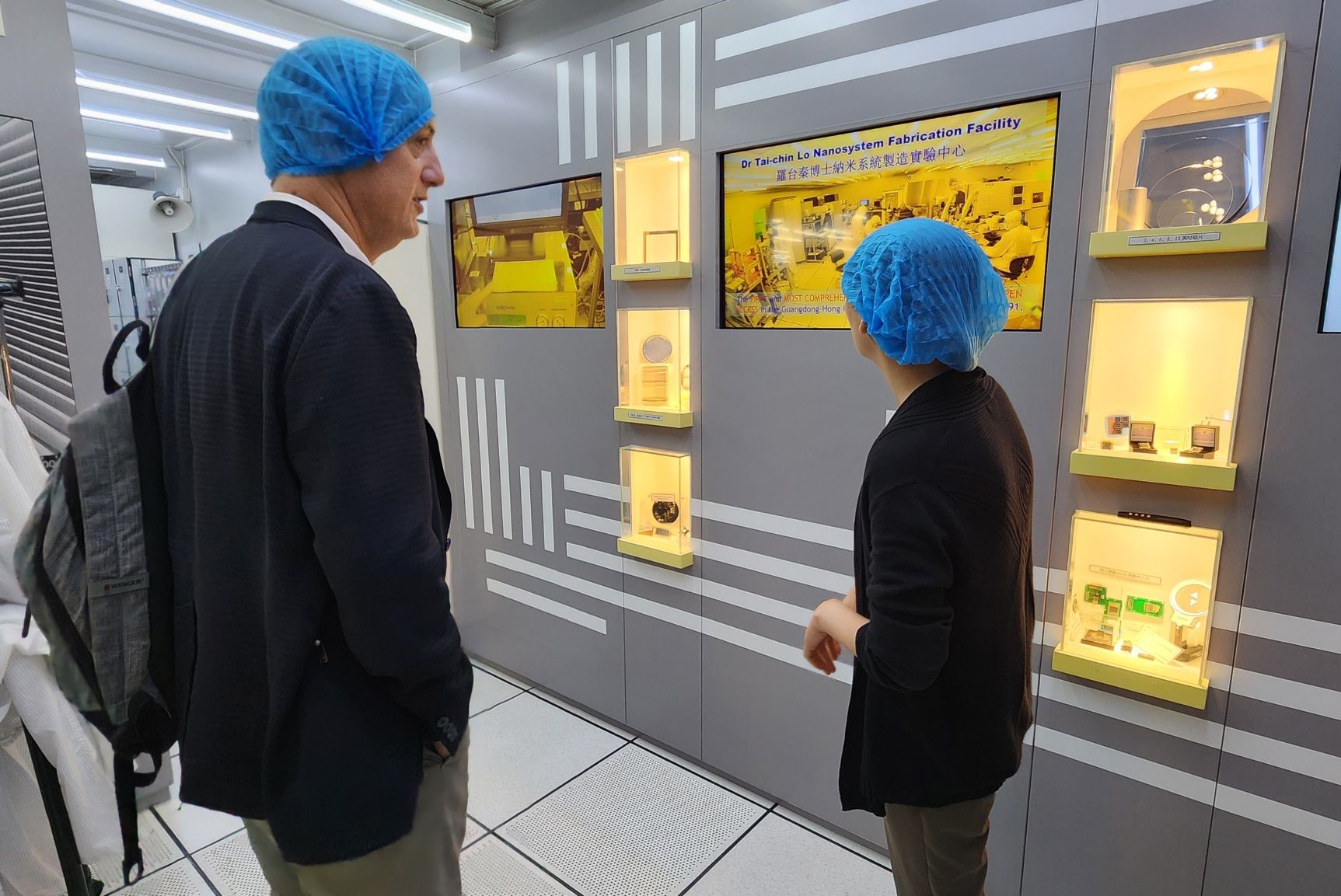 Prof. Hakan ÜREY (left) tours the Dr. Tai-chin LO Nanosystem Fabrication Facility, a state-of-the-art research facility dedicated to the development of micro and nano devices and systems.