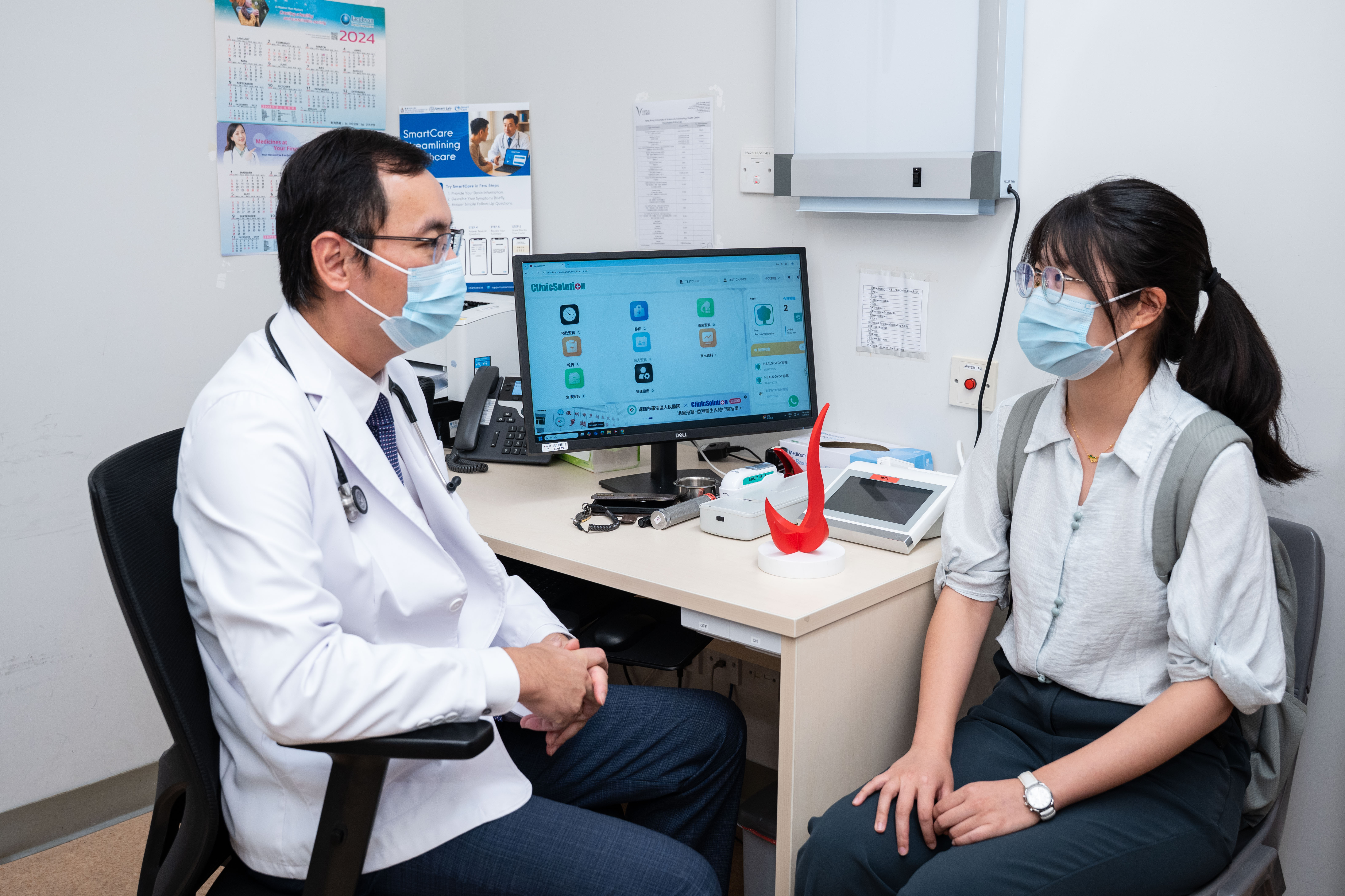 A six-month pilot study is currently underway at the HKUST Clinic, inviting all students, staff, and campus users to participate and provide feedback. Dr. Justin Cheng (left), who is also a registered medical practitioner at HKUST’s clinic. A photo of him demonstrating the usage of SmartCare system to streamline the clinical workflows.