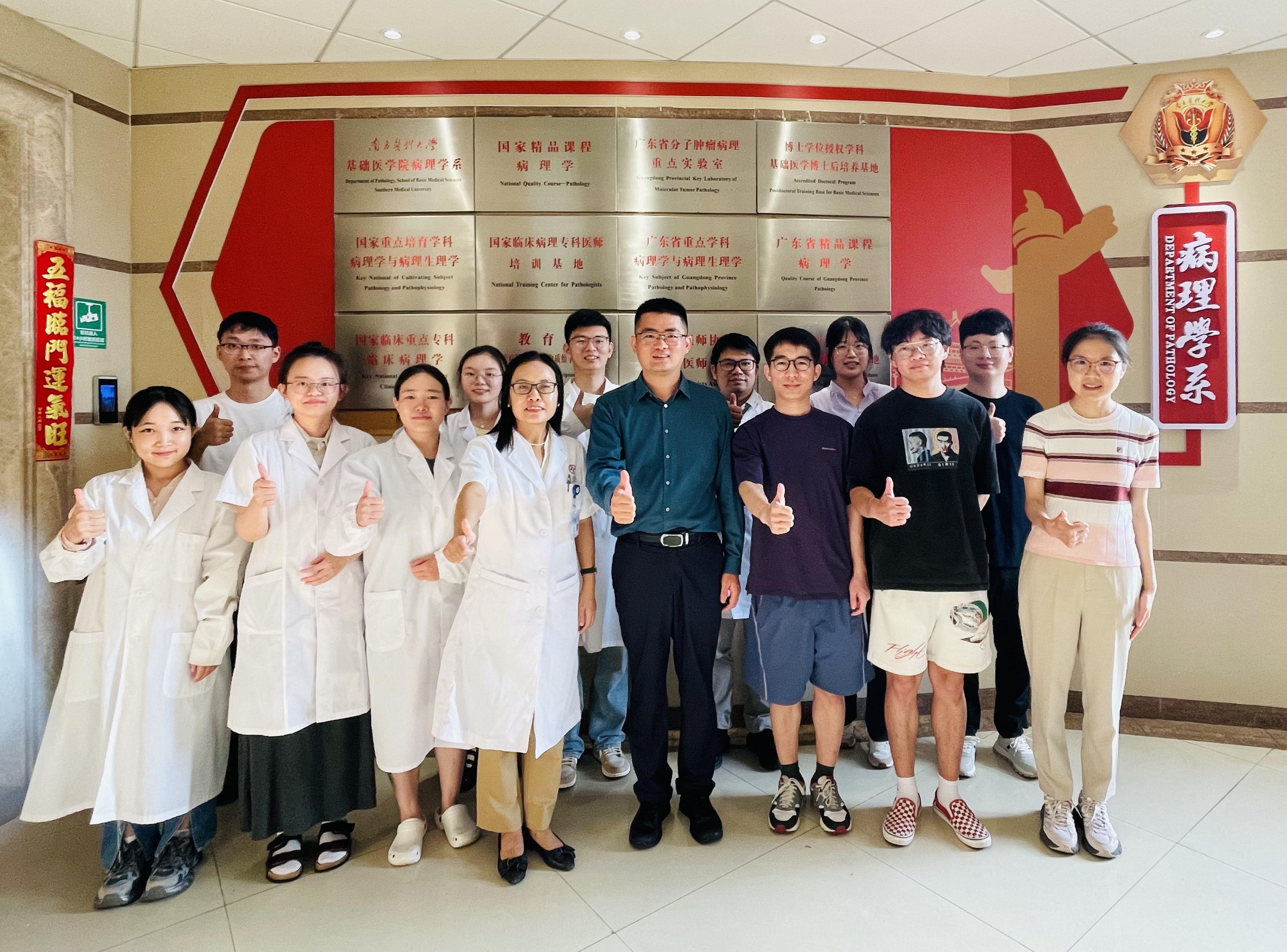 A group photo of Prof. Chen Hao (front row, fourth right), Prof. Liang Li (front row, fourth left) and the members from both research teams.