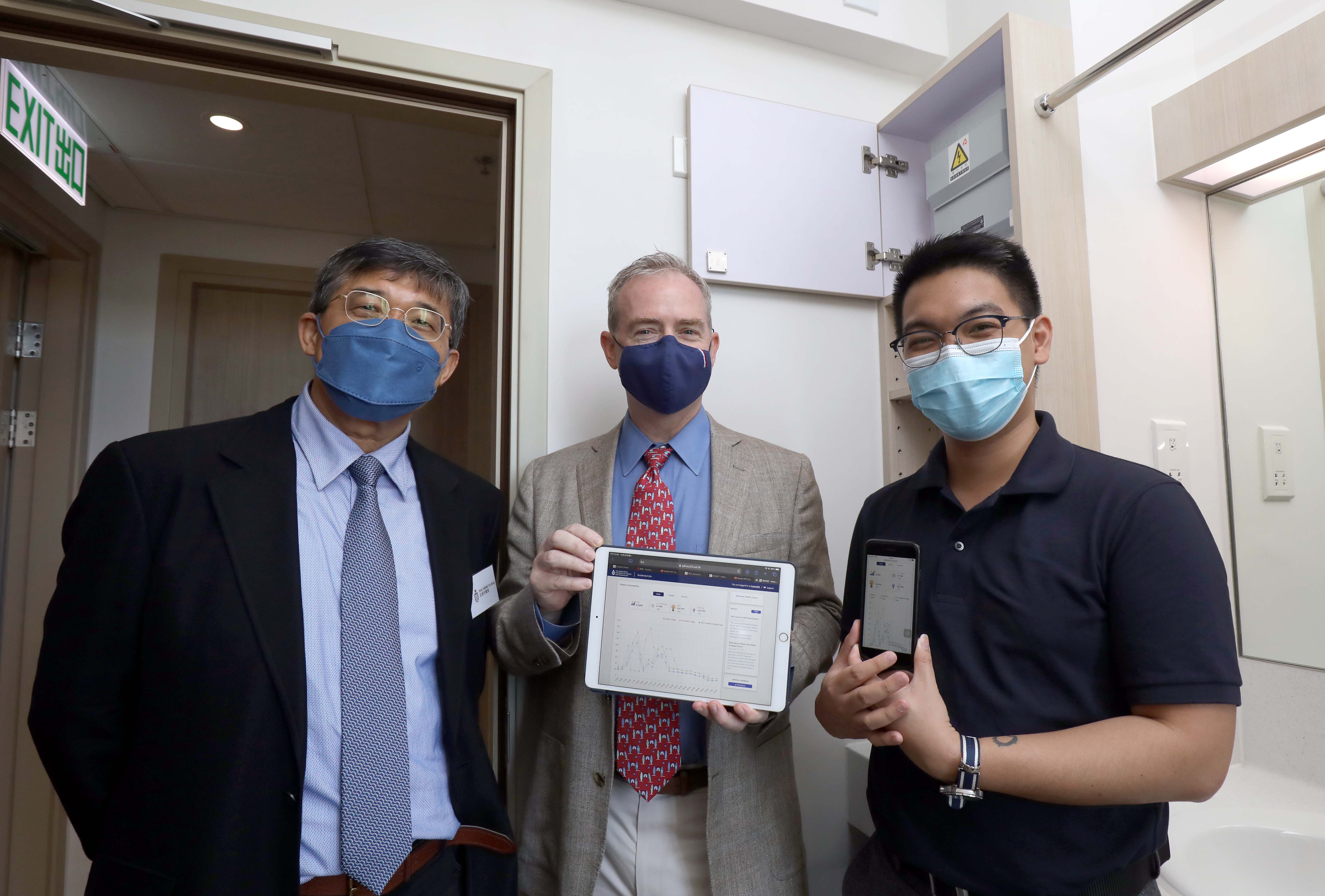 (From left) Prof. WANG Yu-Hsing, Residence Master of Jockey Club Global Graduate Tower; Mr. Davis BOOKHART, Director of Sustainability/Net-Zero Office; and Ginbert Permejo CUATON, current postgraduate student resident demonstrate how to use the interactive smart metering system via smart phone and tablet.