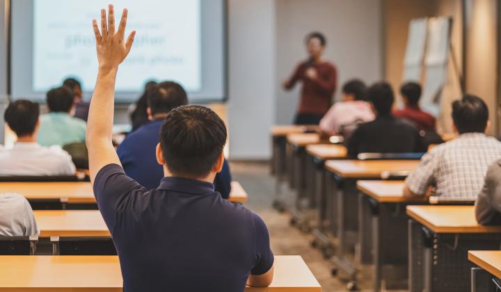 student raising hand